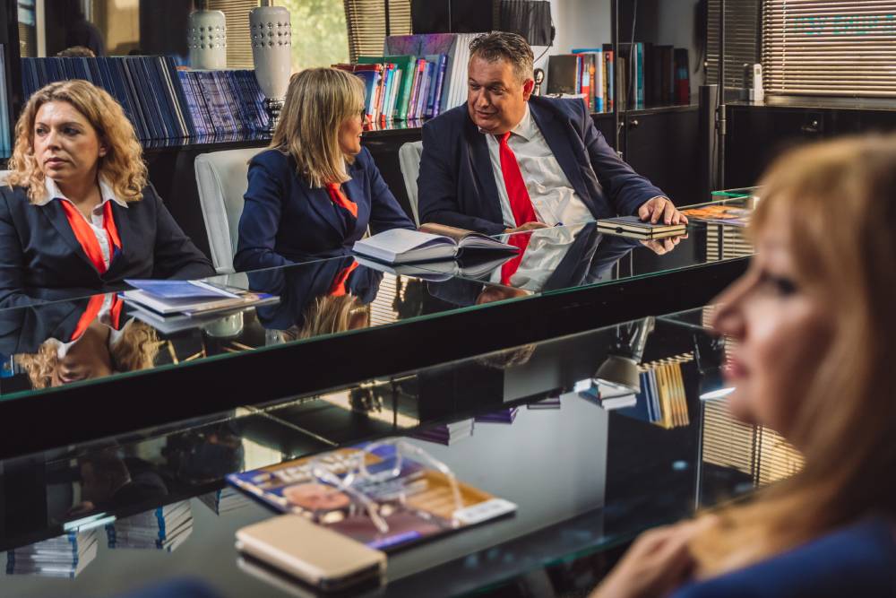 senior business team discussing new business project in meeting at table